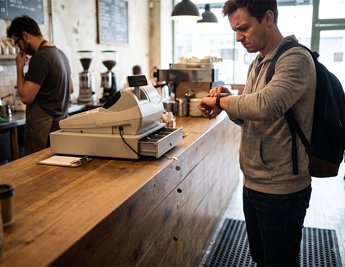 Busy billing counter with a POS screen